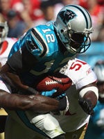 Carolina Panthers head coach John Fox, left, cornerback Richard Marshall  (31) and Carolina Panthers defensive coordinator Ron Meeks are seen during  a time out against the Cleveland Browns in their NFL football