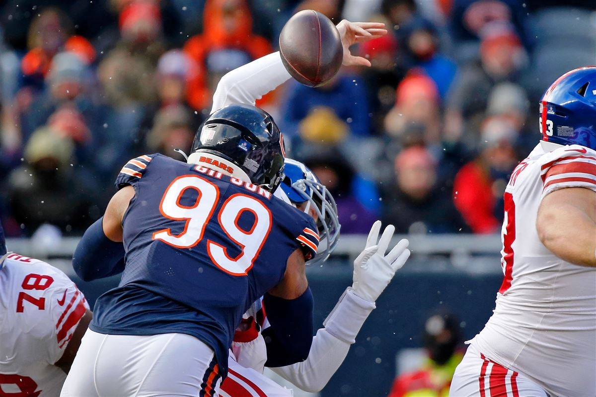 Chicago Bears defensive end Trevis Gipson (99) runs off the field