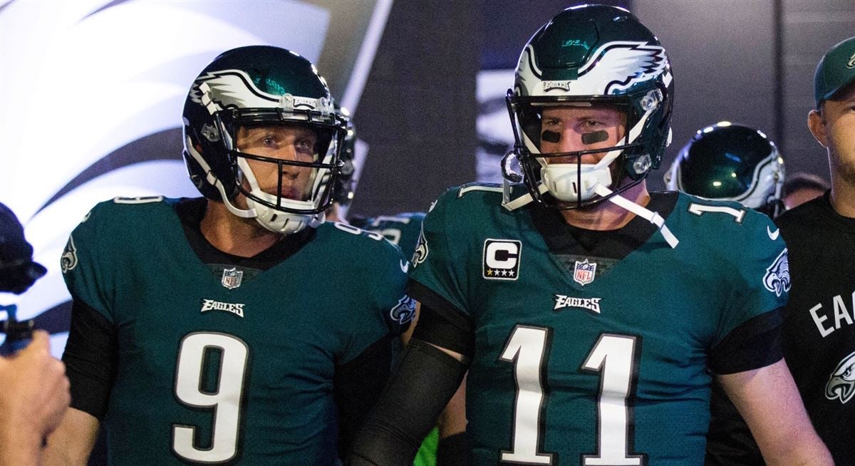 Philadelphia Eagles quarterback Nick Foles raises his arms after throwing a  fourth-quarter touchdown to teammate tight end Zach Ertz against the  Houston Texans on Sunday, Dec. 23, 2018 at Lincoln Financial Field