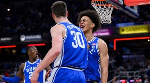 Charlottesville, Virginia, USA. 24th Jan, 2022. Louisville Cardinals guard  Mason Faulkner (11) shoots over Virginia guard Kihei Clark (0) during NCAA  basketball game between the Virginia Cavaliers and the Louisville Cardinals  at