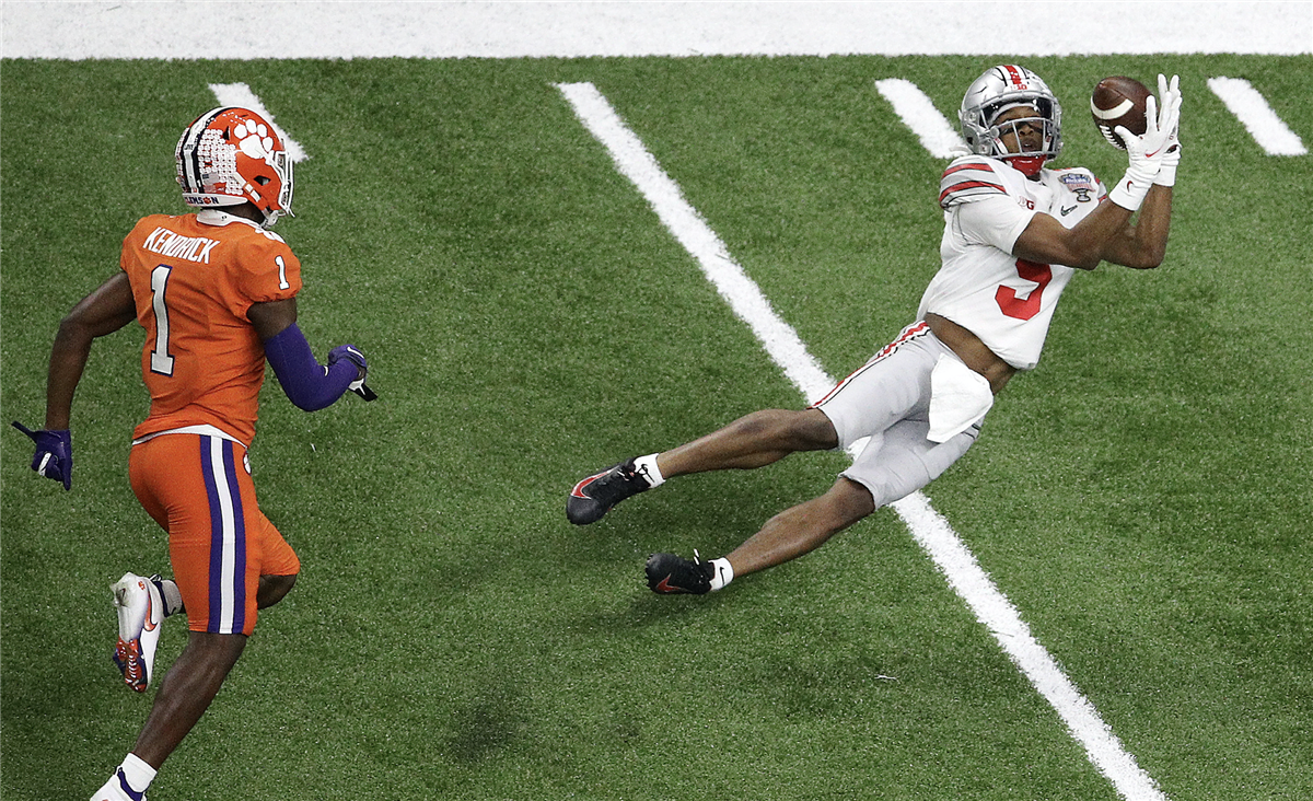 WATCH: Ohio State WR Garrett Wilson goes up and over Clemson defender