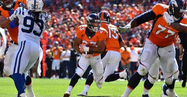 Denver running back Devontae Booker runs down field to the Oakland 25-yard  line during the second quarter Sunday, Jan. 1, 2017, at Sports Authority  Field at Mile High in Denver. (The Gazette