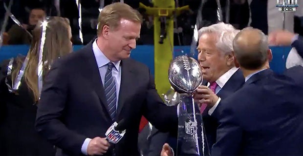 The Vince Lombardi Trophy for Super Bowl XLIII is on display along with  helmets for the Pittsburgh Steelers (L) and Arizona Cardinals as NFL  Commissioner Roger Goodell holds a news conference to