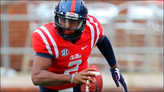 September 24, 2016: D'Andre Walker (15) Georgia Bulldogs linebacker hits  Jason Pellerin (7) Ole Miss Rebels quarterback as he passes during the game  between the Georgia Bulldogs and Ole Miss Rebels .