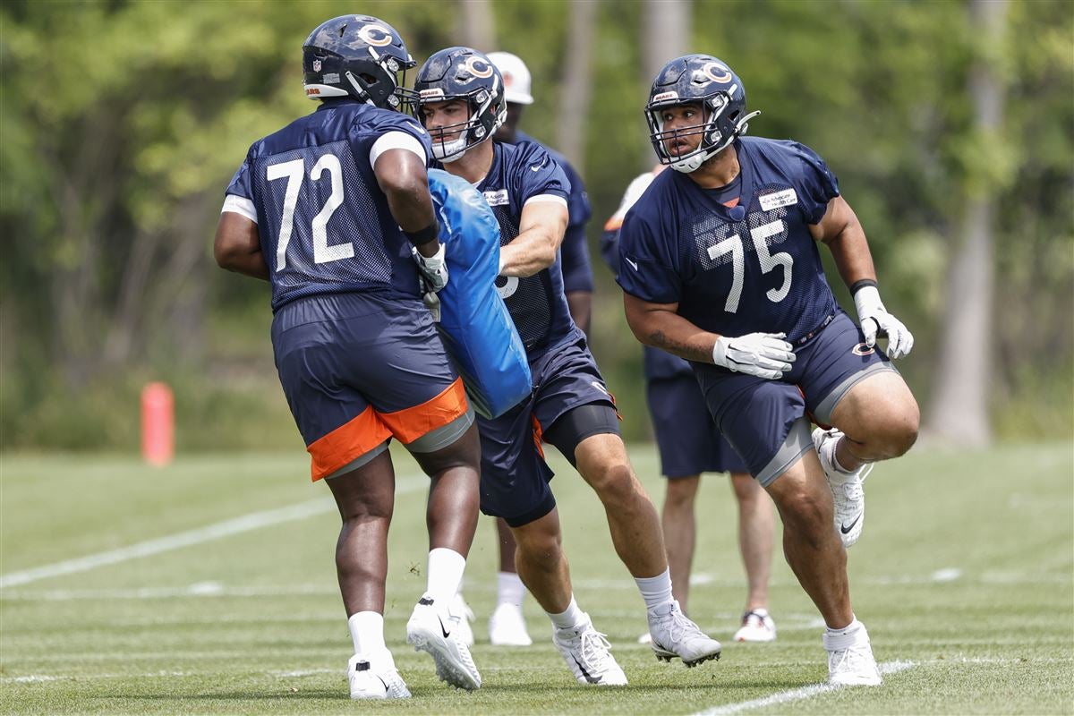 Chicago Bears offensive tackle Larry Borom (75) looks on during