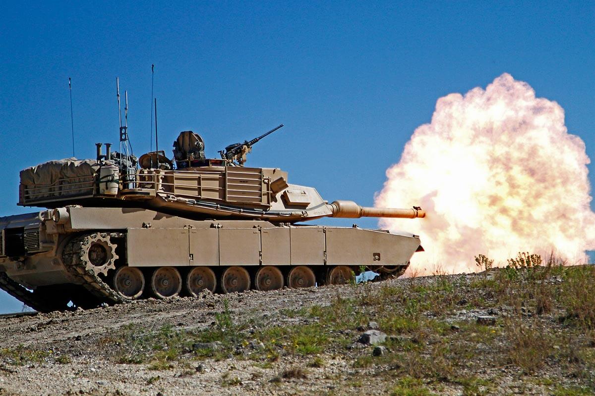 image: military tank driving toward you