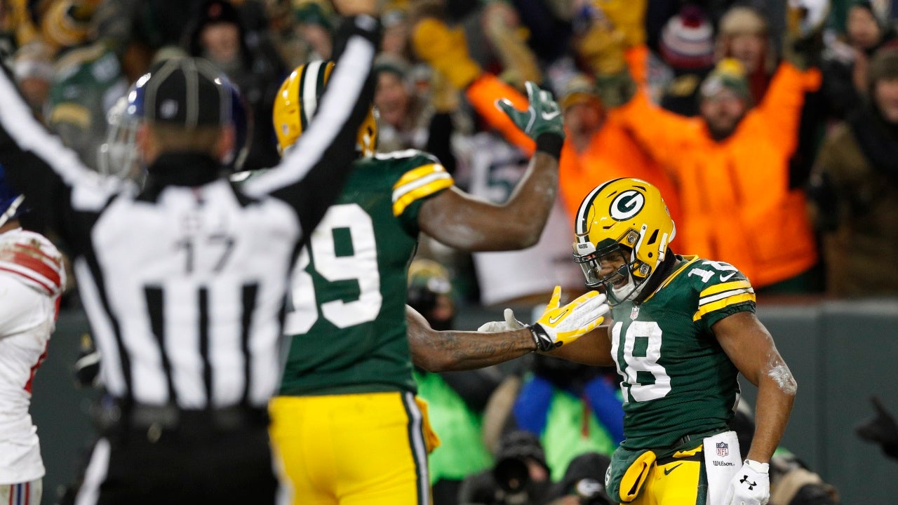 Green Bay Packers' Randall Cobb makes snow angel in end zone