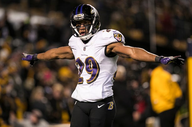 Baltimore Ravens quarterback Lamar Jackson (8) takes to the field with a  member of the military as part of Salute to Service before an NFL football  game against the Carolina Panthers, Sunday