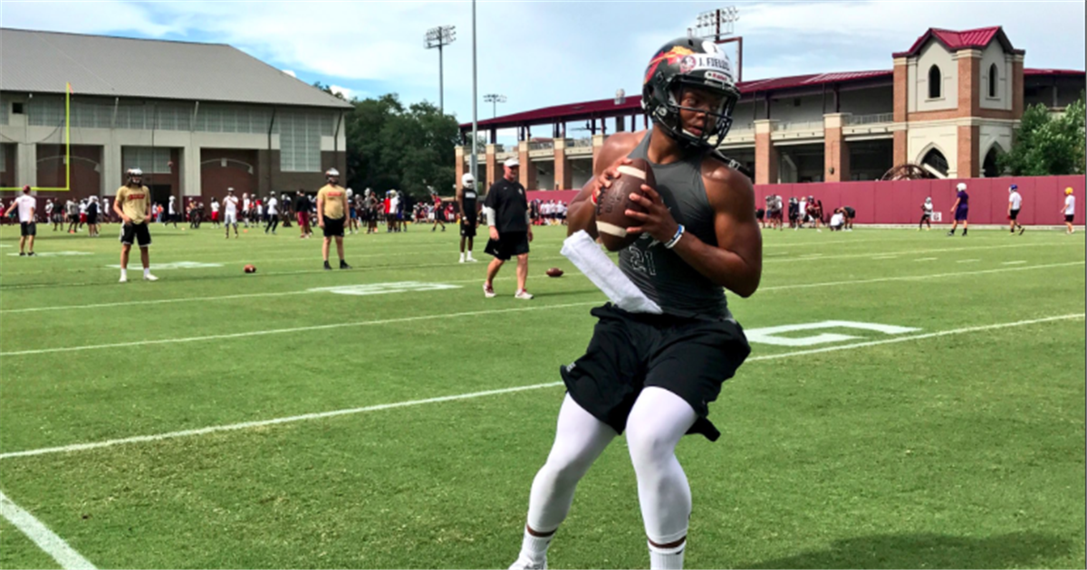 Justin Fields enjoys working with Fisher, FSU staff at camp Justin Fields enjoys working with Fisher, FSU staff at camp