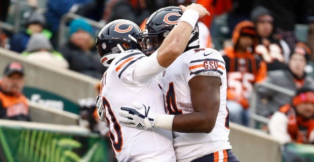 Detroit Lions running back D'Andre Swift (32) is brought down by Chicago  Bears linebacker Nicholas Morrow (53) during the first half of an NFL  football game in Chicago, Sunday, Nov. 13, 2022. (