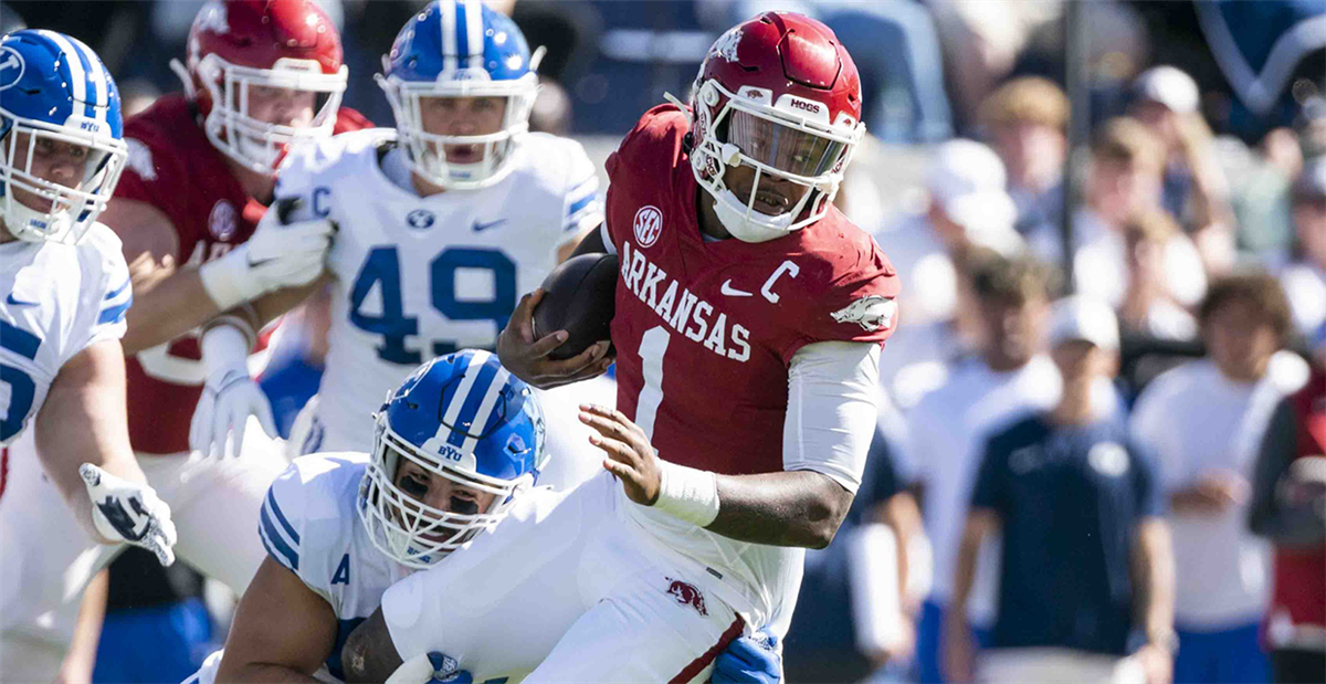 Arkansas quarterback KJ Jefferson wears bowl championship rings