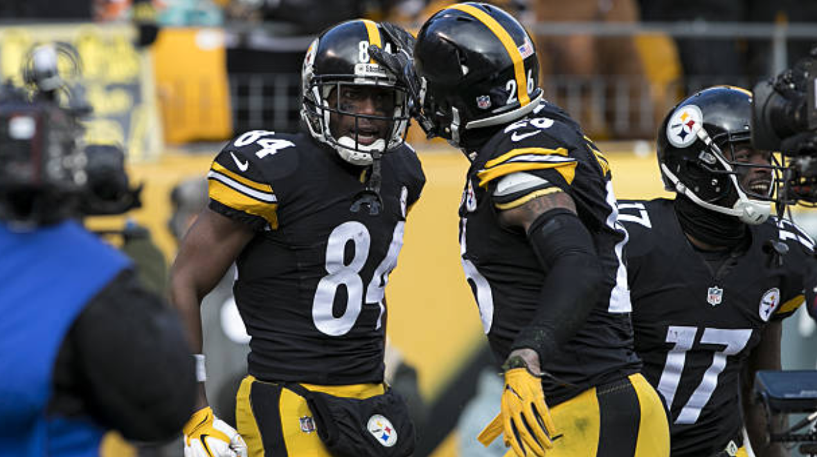 New England Patriots Asante Samuel pats a disappointed Pittsburgh Steelers  Ben Roethlisberger on the helment following the AFC Championship game at  Heinz Field on January 23 ,2005 . The Patriots defeated the