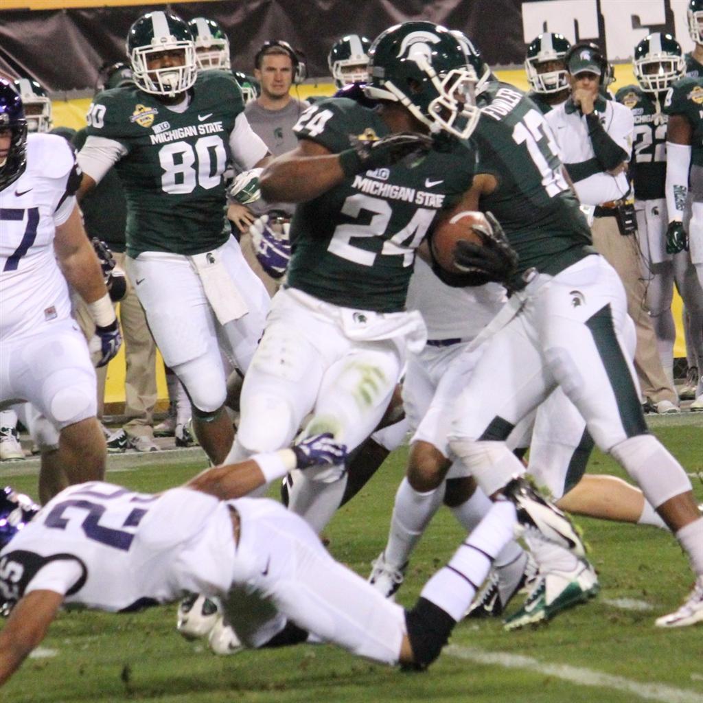 Le'Veon Bell Michigan State Spartans Fanatics Authentic Unsigned Touchdown  vs. Michigan Photograph