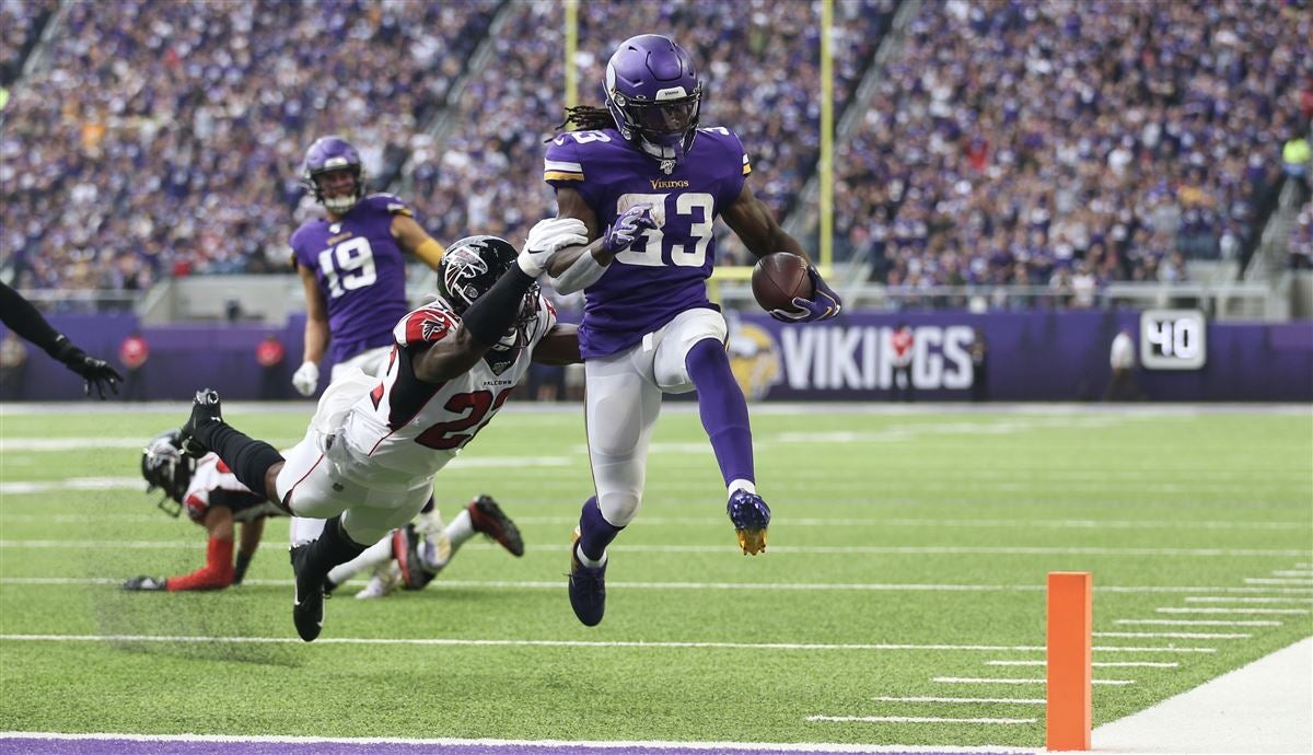 Carson, California, USA. 15th Dec, 2019. Minnesota Vikings running back Dalvin  Cook (33) carries the ball as Los Angeles Chargers free safety Derwin James  (33) defends during the NFL game between the