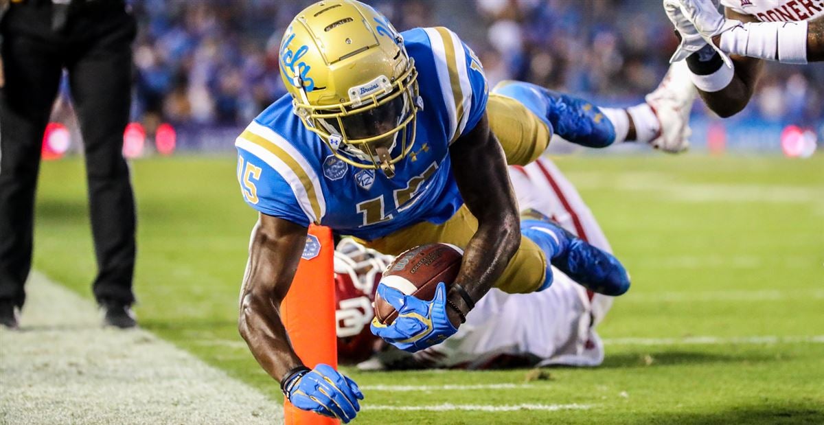 Bruins running back Demetric Felton J. gains yards on a run during