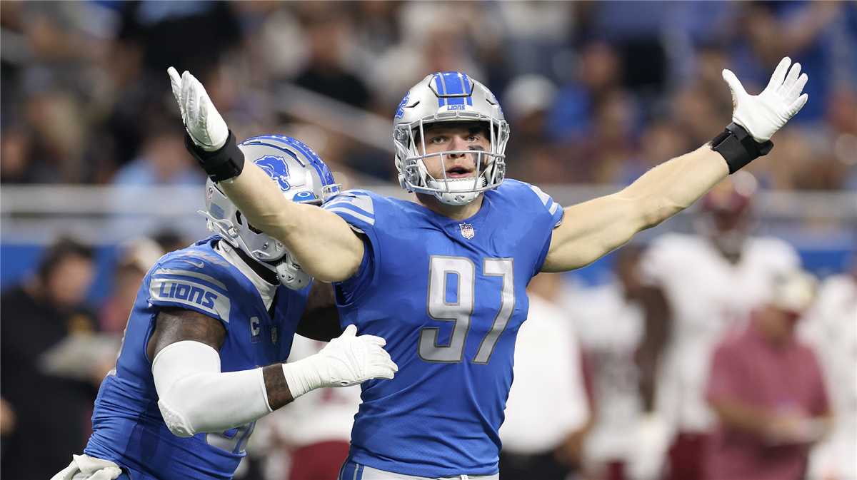 Detroit Lions defensive end Aidan Hutchinson delivers strip-sack