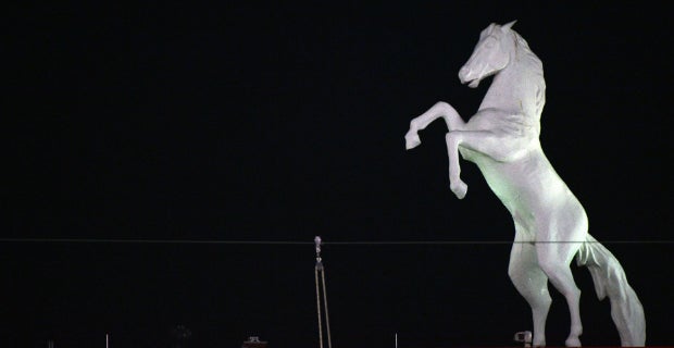 Denver Broncos Bucking Thunder Mascot With Football Player 