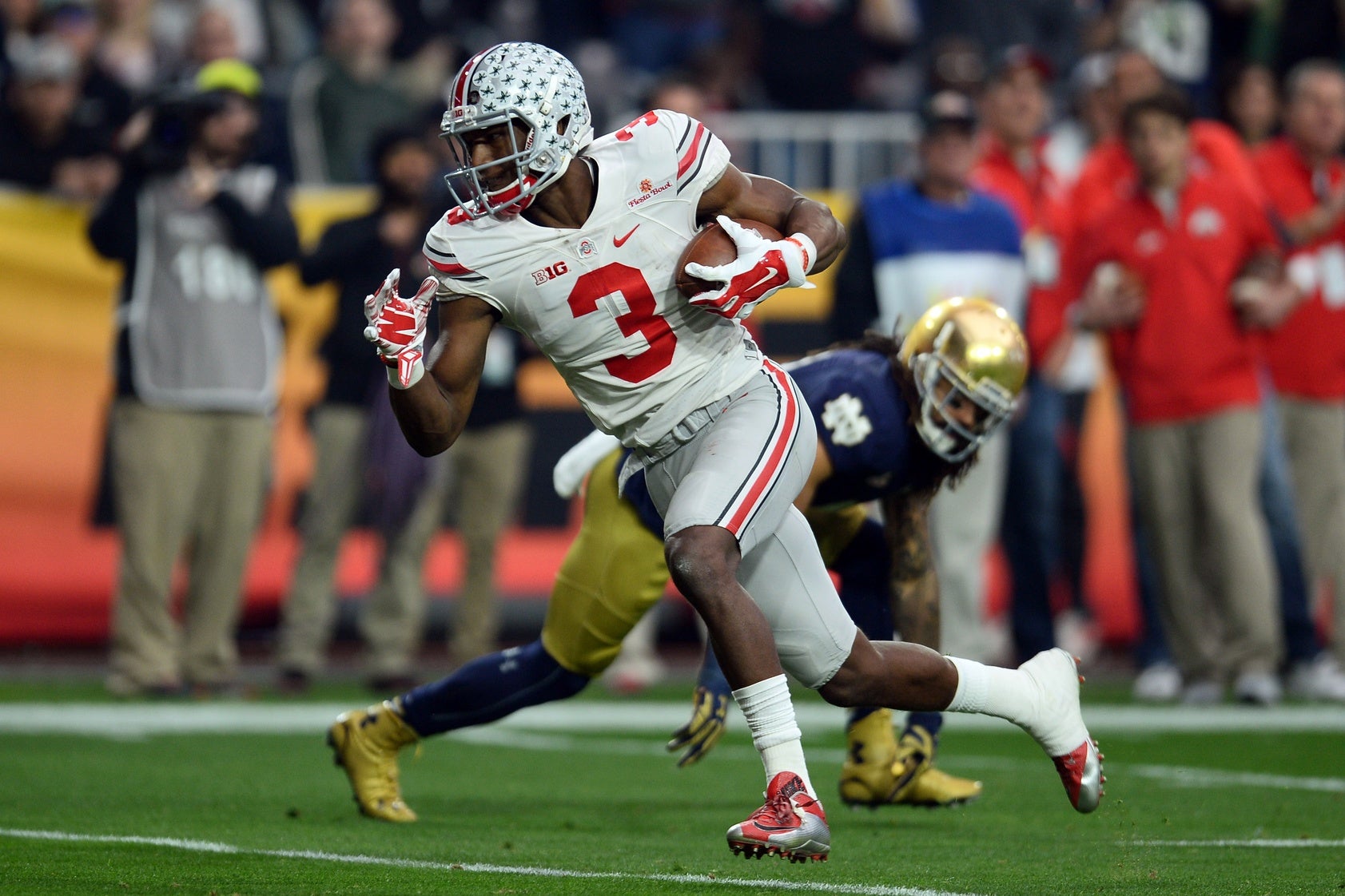 Dressed in Buckeyes gear, Tom Brady pays off Ohio State bet 