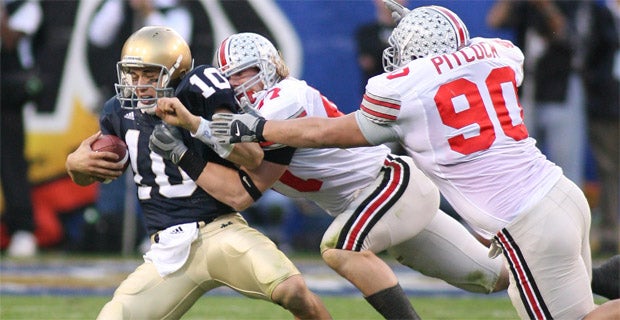 Ohio State linebacker A.J. Hawk (47) celebrates with teammate