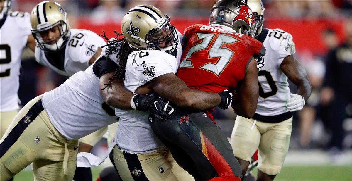 Seattle Seahawks defensive tackle Tony McDaniel (99) bats down a