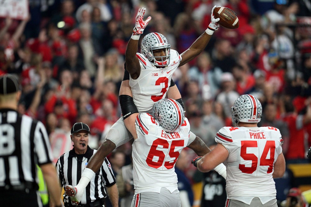 Ohio State linebacker A.J. Hawk goes in for the sack on Notre Dame  quarterback Brady Quinn (10) in the second half of the Fiesta Bowl college  football game, Monday, Jan. 2, 2006