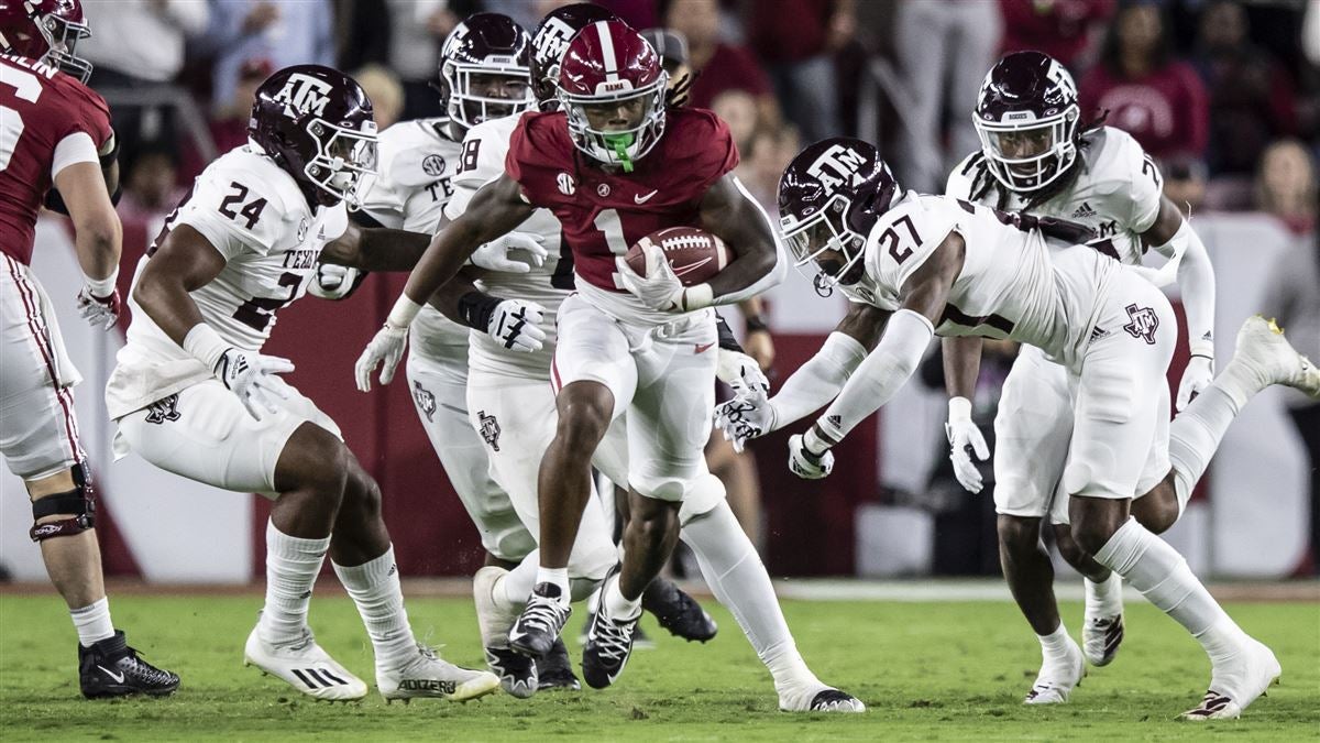 Jahmyr Gibbs of the Alabama Crimson Tide is tackle by Demani