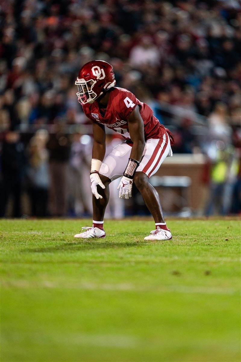 Oklahoma cornerback Jaden Davis (4) lines up to tackle Iowa State