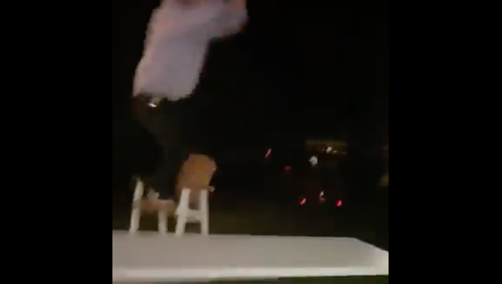 Bills draft pick Spencer Brown celebrates by jumping through table