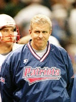 Members of the New England Patriots 2001 Super Bowl XXXVI team Lawyer Milloy,  left, and Drew Bledsoe, right, high five while standing on stage near  Patriots owner Robert Kraft, center, as they