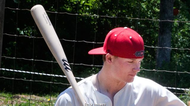 Cubs outfielder Ian Happ carted off the field as the former Bearcat faces  the Reds