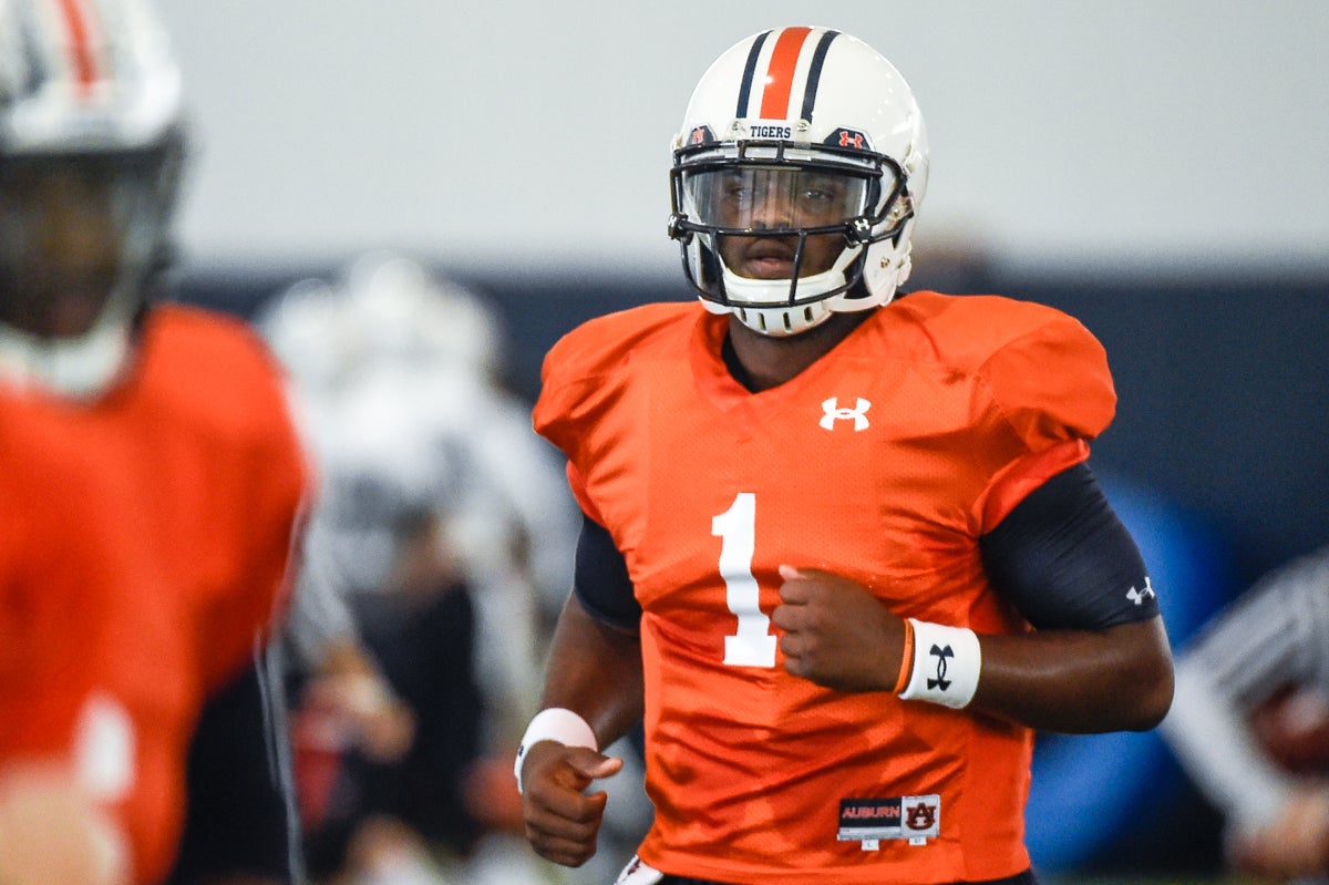 Auburn rookie Woody Barrett runs quarterback drills at practice 