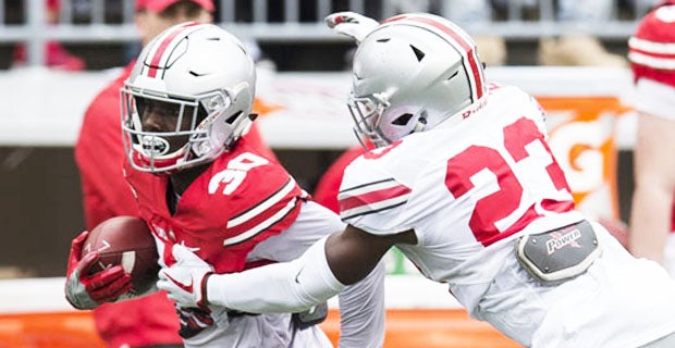 September 03 2016: Quarterback Joe Burrow (10) of the Ohio State Buckeyes  hands the ball off to running back Demario McCall (30) of the Ohio State  Buckeyes during the game between the