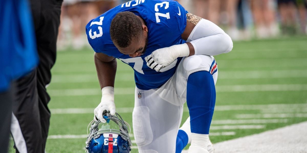 Giants first-round pick Evan Neal carted off against Jaguars, ruled out  with knee injury 