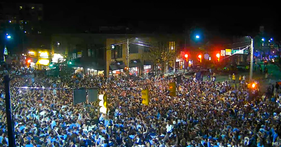 WATCH UNC Students & Fans Rush Franklin Street After Upset Win Over Duke