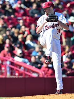 Starting pitcher Jordan Montgomery (34) of the South Carolina Gamecocks is  congratulated by teammates after being pulled in the ninth inning in an  NCAA Division I Baseball Regional Tournament game against the