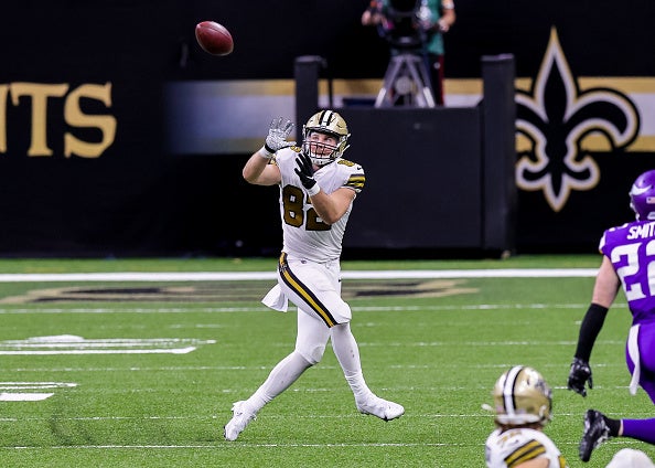 New Orleans Saints tight end Adam Trautman (82) gets tackled after a  reception during an NFL preseason game against the Houston Texans on  Saturday, August 13, 2022, in Houston. (AP Photo/Matt Patterson