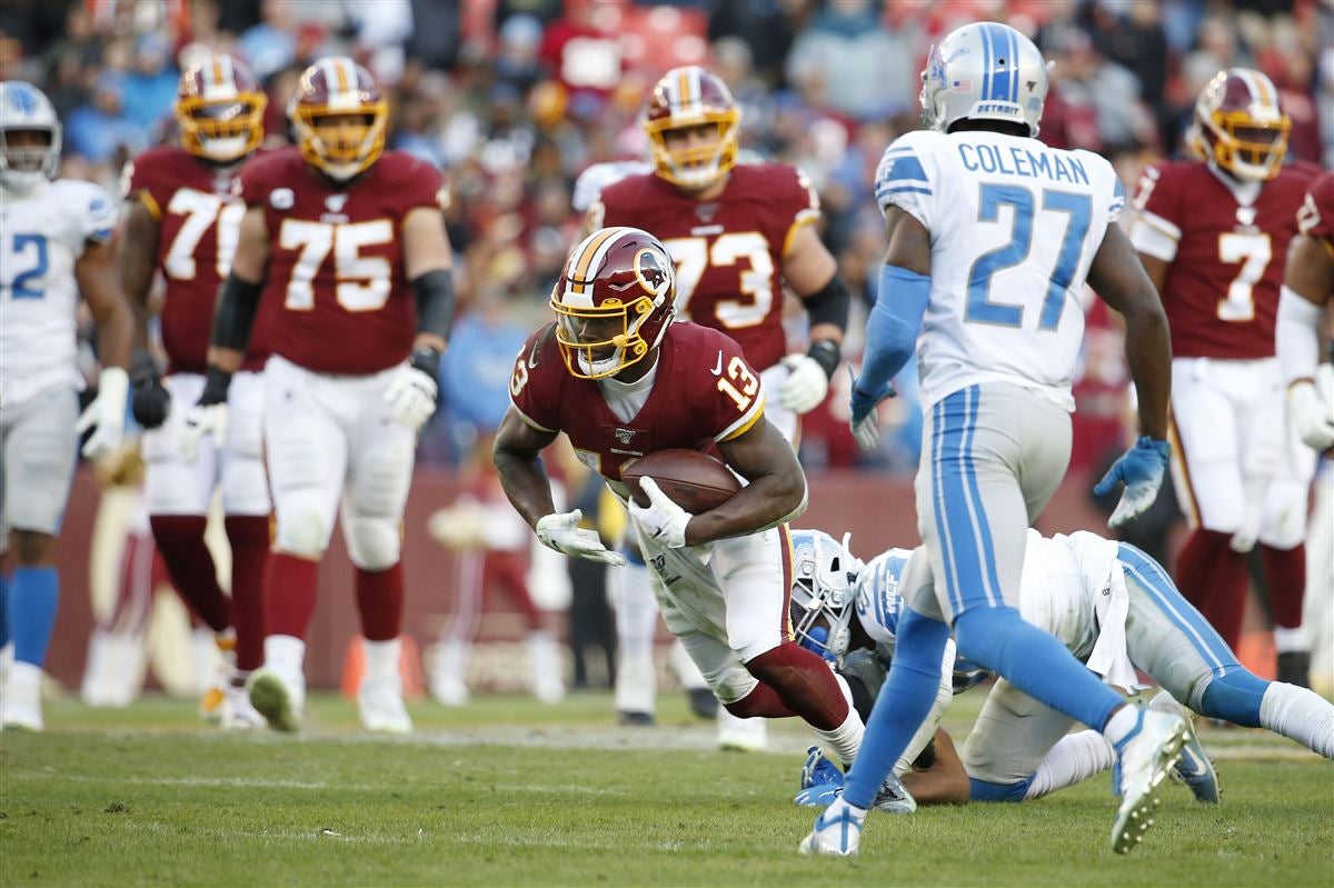 Washington Commanders wide receiver Kelvin Harmon (13) jogs onto the field  before an NFL preseason football game against the Carolina Panthers,  Saturday, Aug. 13, 2022, in Landover, Md. (AP Photo/Alex Brandon Stock