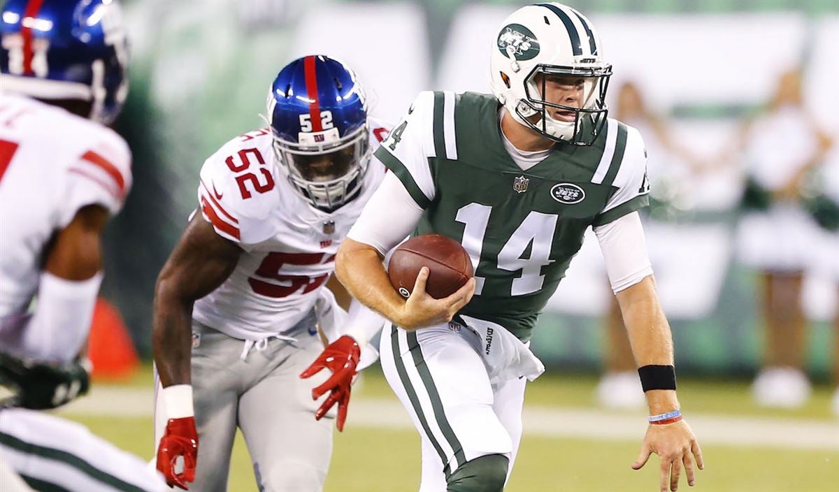 Rick Mirer of the New York Jets runs with the ball during the game