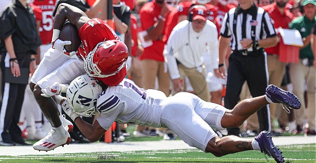 Illinois at Rutgers - 11/14/2020 - Image 15: Nov 14, 2020; Piscataway, New  Jersey, USA; Rutgers Scarlet Knights wide receiver Isaiah Washington (83)  is tackled by Illinois Fighting Illini defensive back Nate