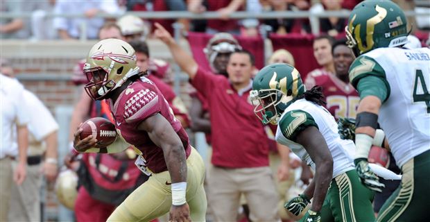 Florida State Seminoles running back Dalvin Cook (4) takes a hand off on  the 2nd play from scrimmage and runs 75 yards for a touchdown during the  NCAA Football game between Florida