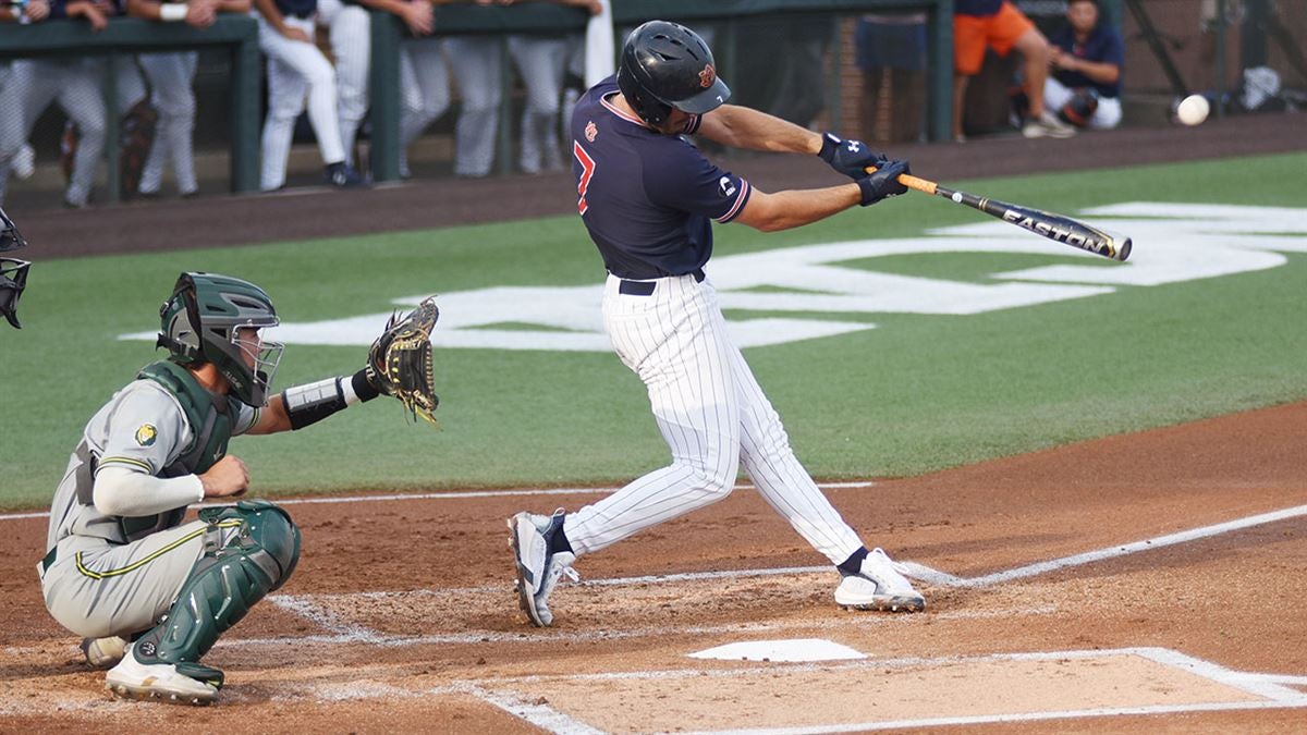 Auburn infielder Cole Foster (7) runs to first after hitting a