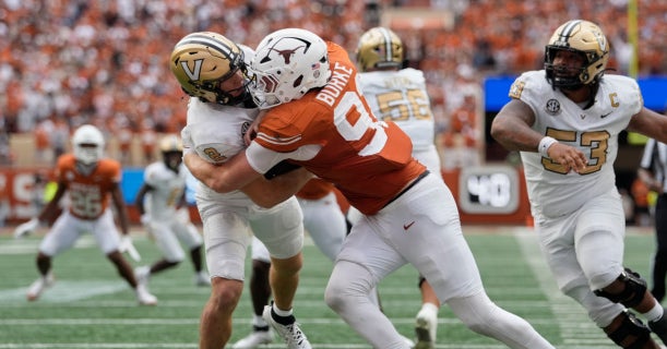 Former Texas DE Ethan Burke focused on becoming a Baltimore Raven, not on returning to college