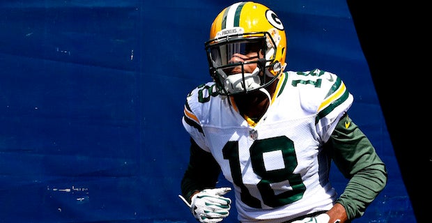 Watch: Randall Cobb holds on after being unloaded on, scores TD