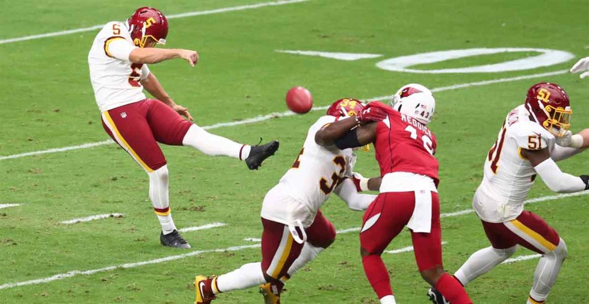 Washington Commanders punter Tress Way (5) punts the ball during