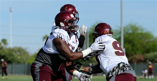 Arizona State defensive lineman Renell Wren runs a drill at the