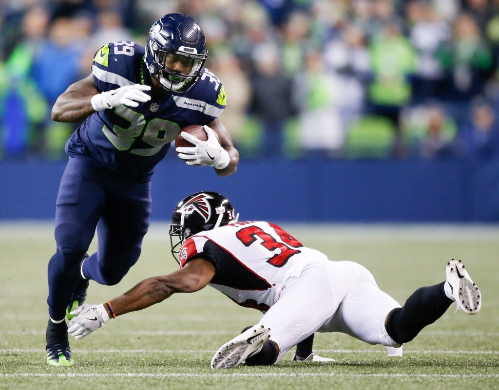 Seattle Seahawks running back (27) Mike Davis heads for the field