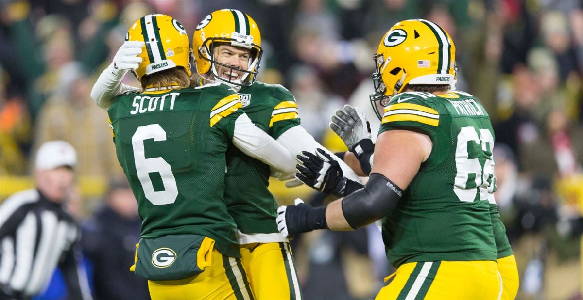 Green Bay Packers running back Aaron Jones (33) runs in front of San  Francisco 49ers cornerback Richard Sherman (25) and strong safety Jaquiski  Tartt (29) during the NFL football NFC Championship game