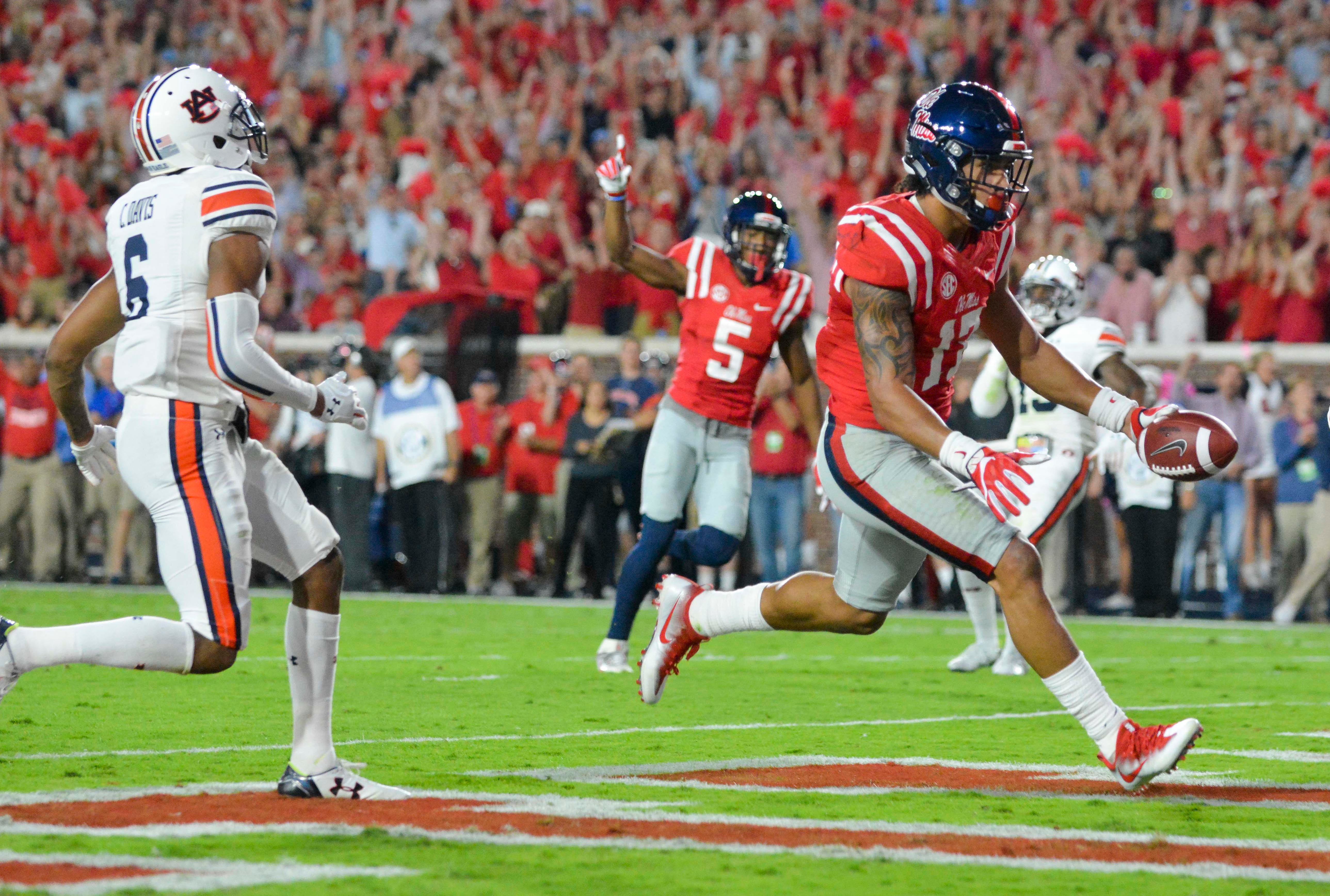 September 24, 2016: D'Andre Walker (15) Georgia Bulldogs linebacker hits  Jason Pellerin (7) Ole Miss Rebels quarterback as he passes during the game  between the Georgia Bulldogs and Ole Miss Rebels .