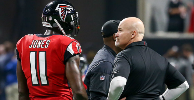 Michael Vick of the Atlanta Falcons with T.I. during Radio One News  Photo - Getty Images