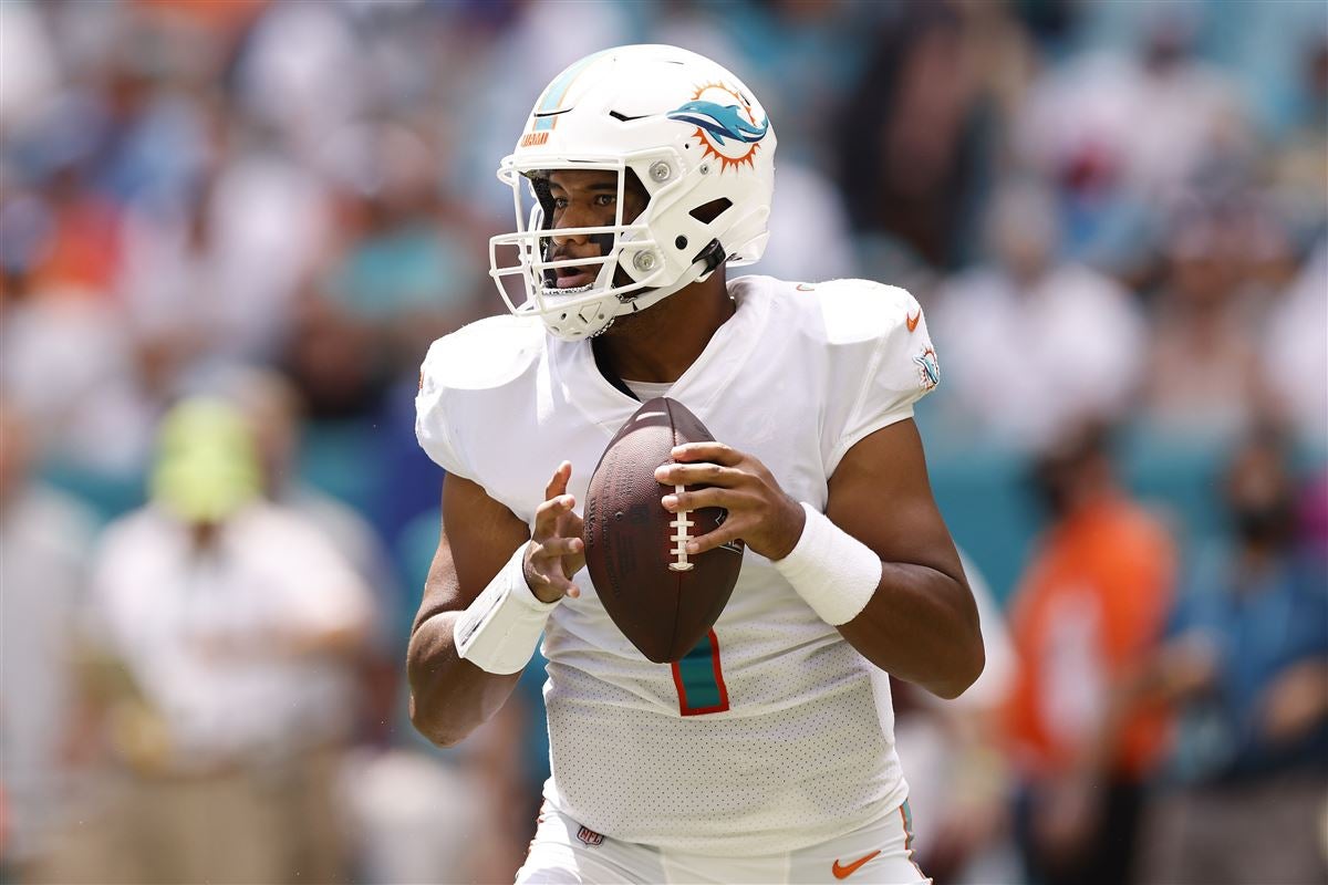 Miami Dolphins Tua putting helmet on as Jacoby Brissett goes down